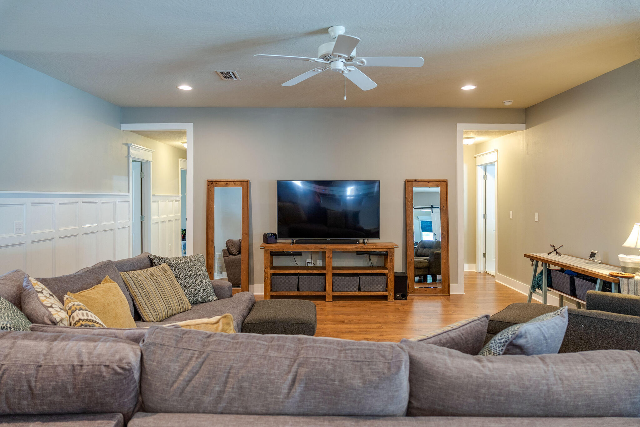 4723 Chanson Crossing Crestview, FL 32539 - Photo 12 of 58 a living room with furniture and a flat screen tv