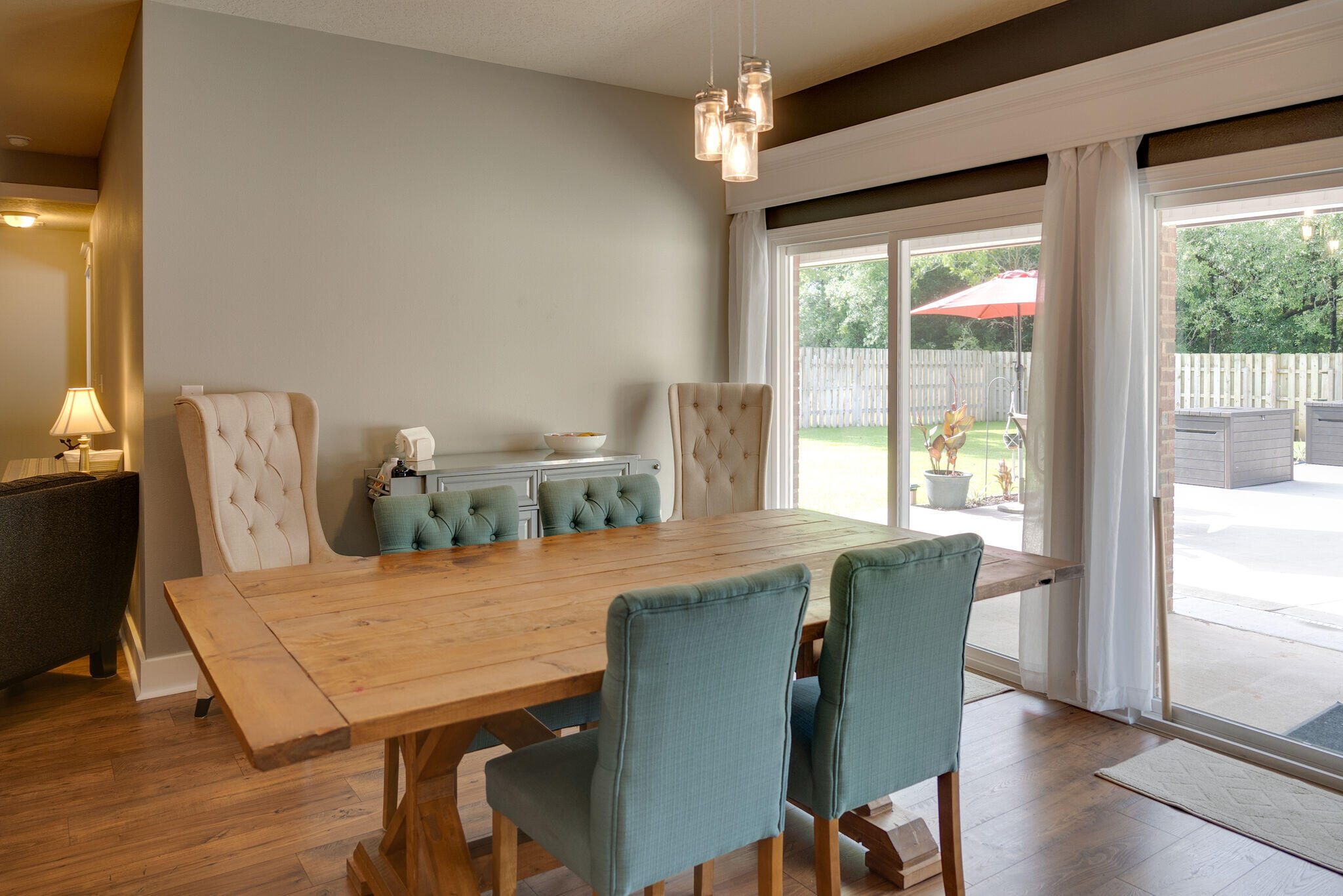 4723 Chanson Crossing Crestview, FL 32539 - Photo 14 of 58 a view of a dining room with furniture window and wooden floor