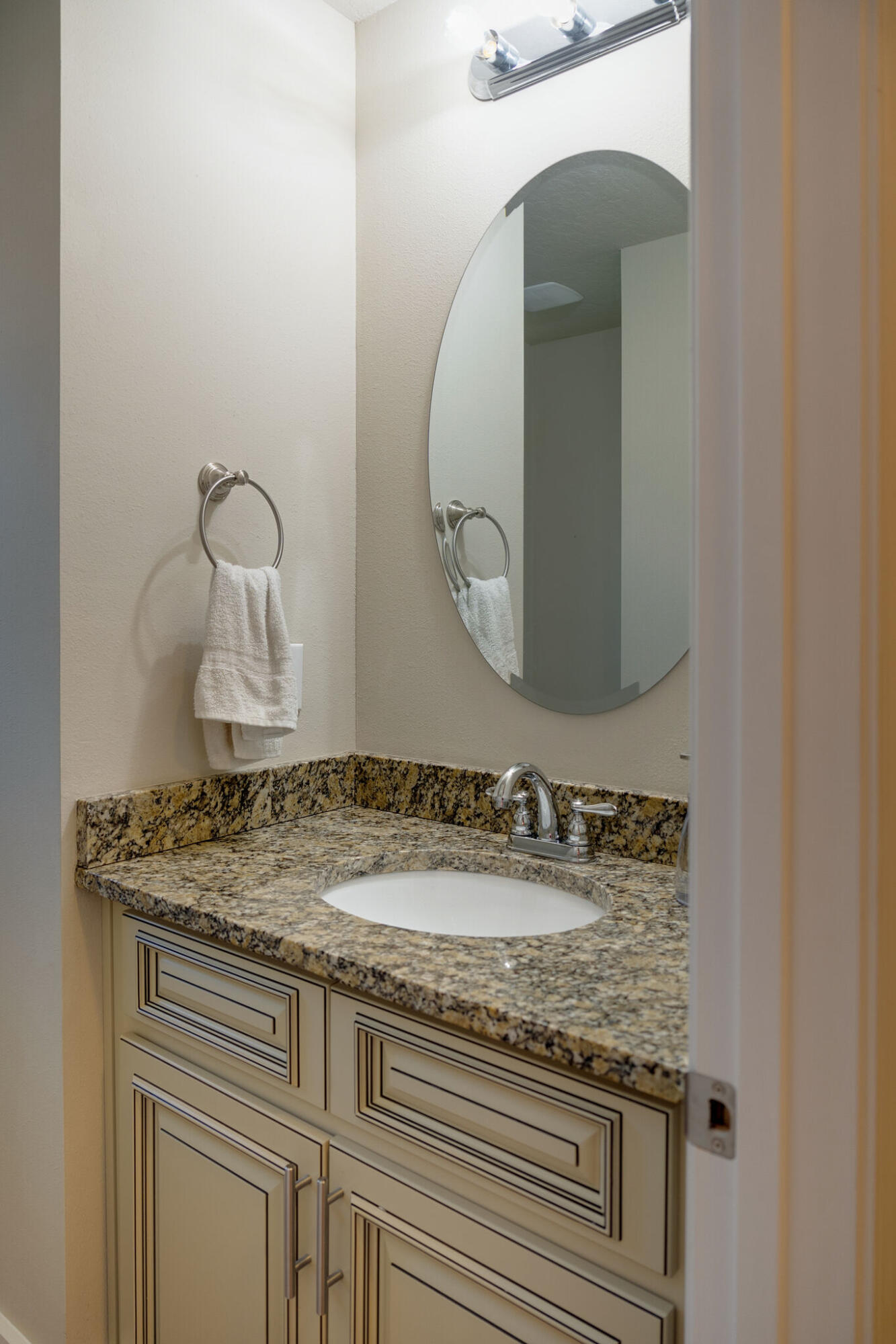4723 Chanson Crossing Crestview, FL 32539 - Photo 22 of 58 a bathroom with a granite countertop sink and a mirror