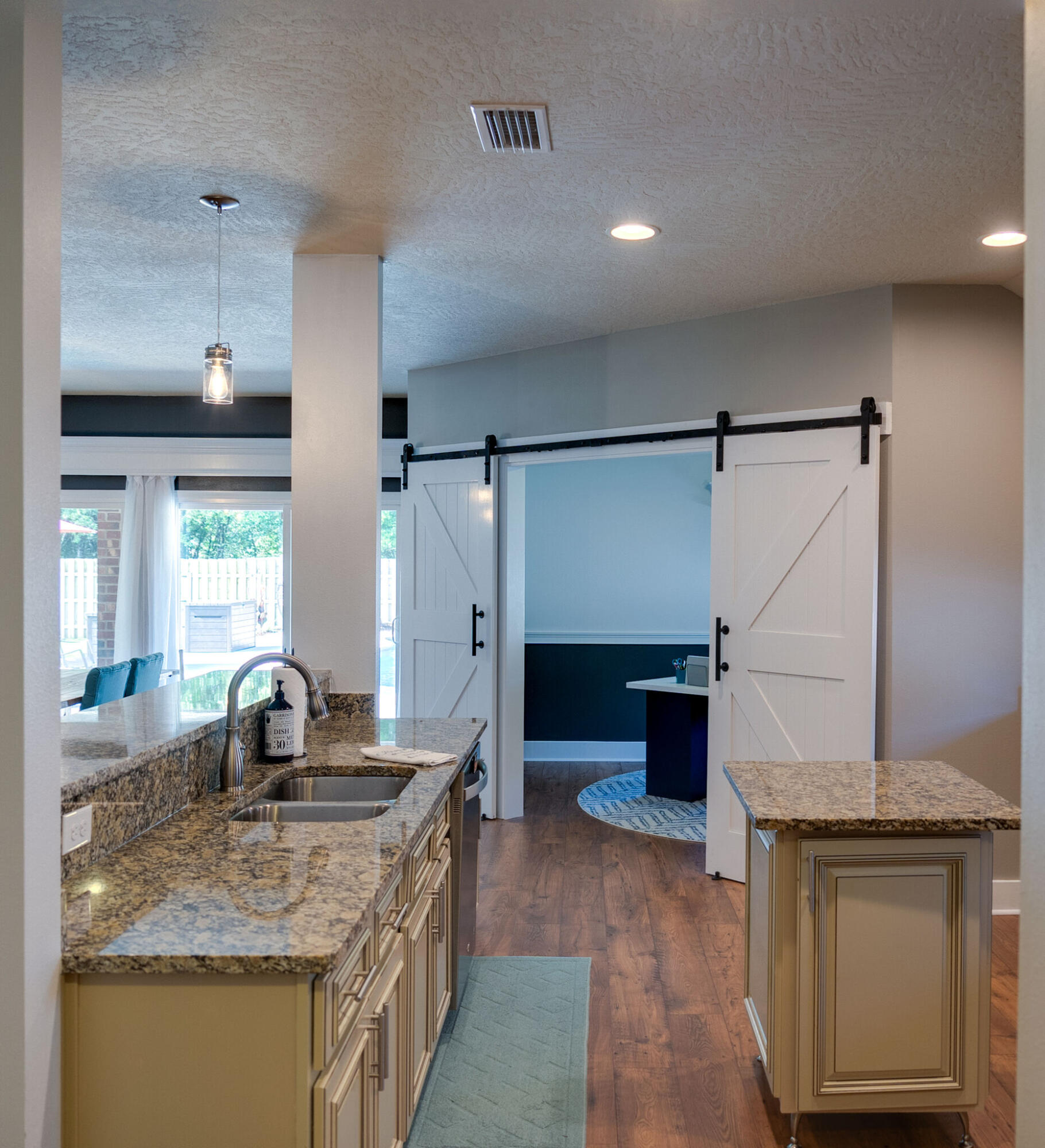 4723 Chanson Crossing Crestview, FL 32539 - Photo 23 of 58 a kitchen with stainless steel appliances granite countertop a sink stove and cabinets