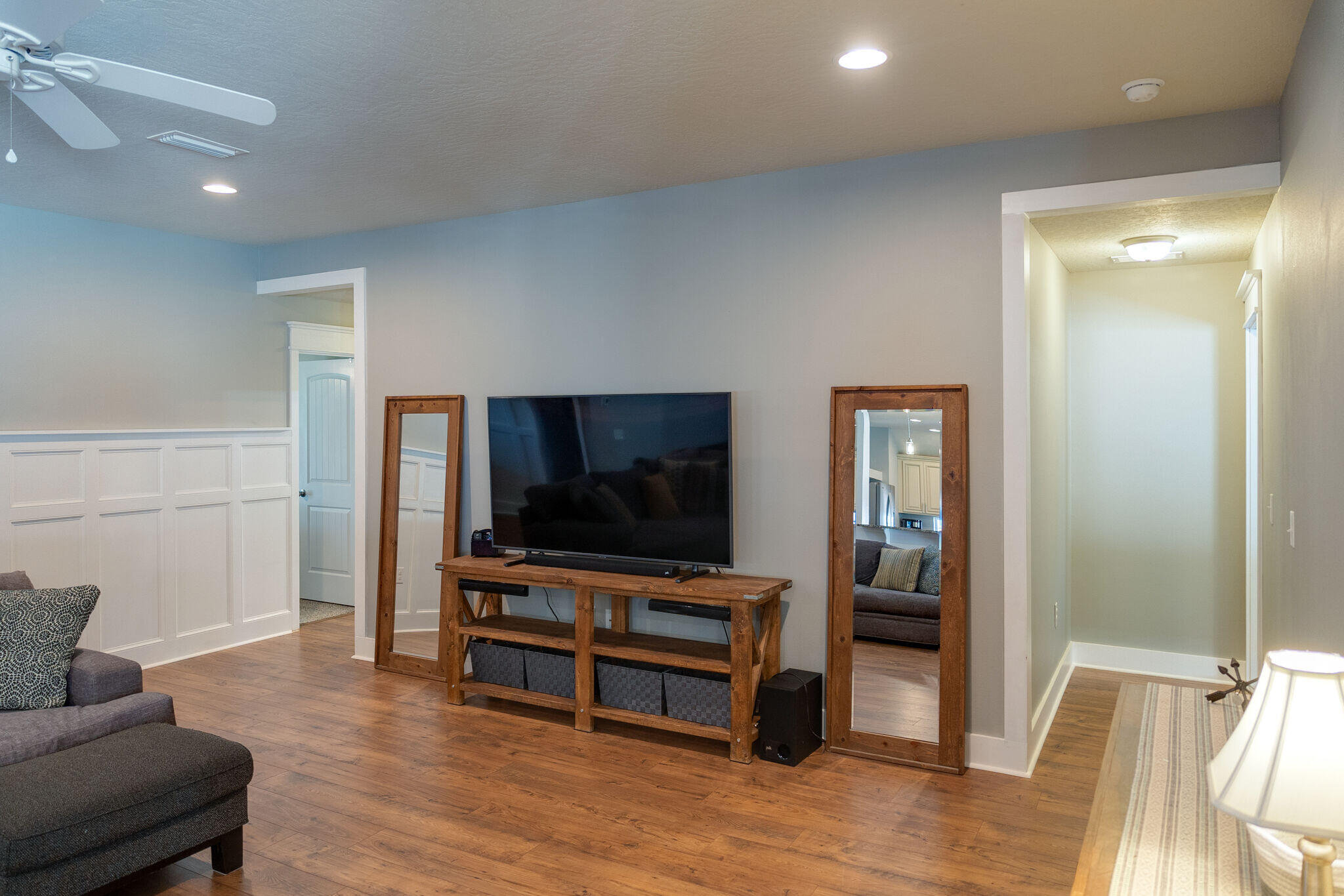 4723 Chanson Crossing Crestview, FL 32539 - Photo 24 of 58 a living room with furniture and a flat screen tv