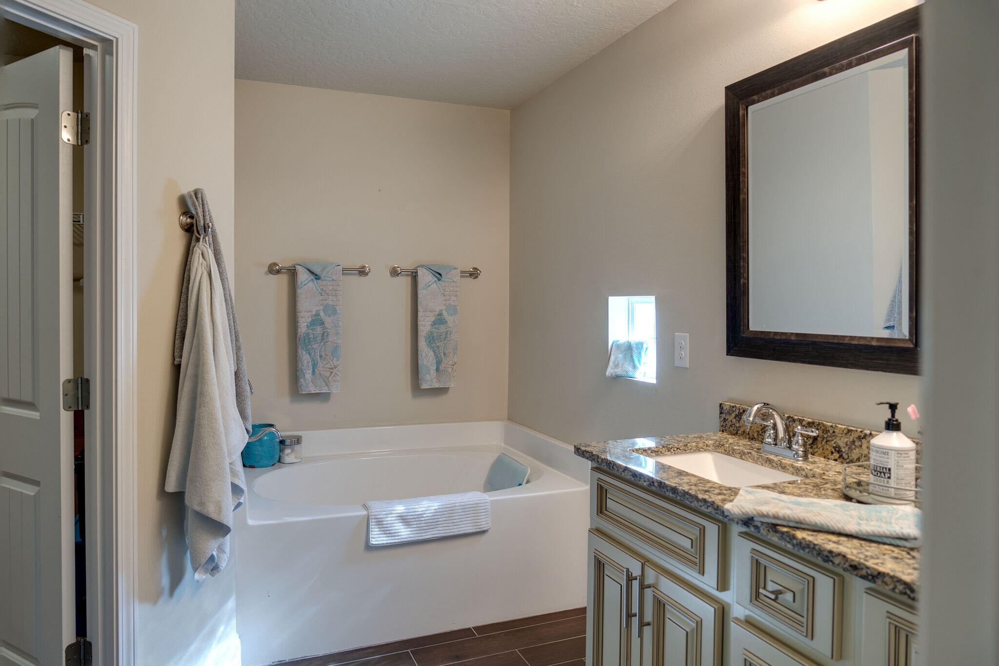 4723 Chanson Crossing Crestview, FL 32539 - Photo 28 of 58 a bathroom with a granite countertop sink and a mirror