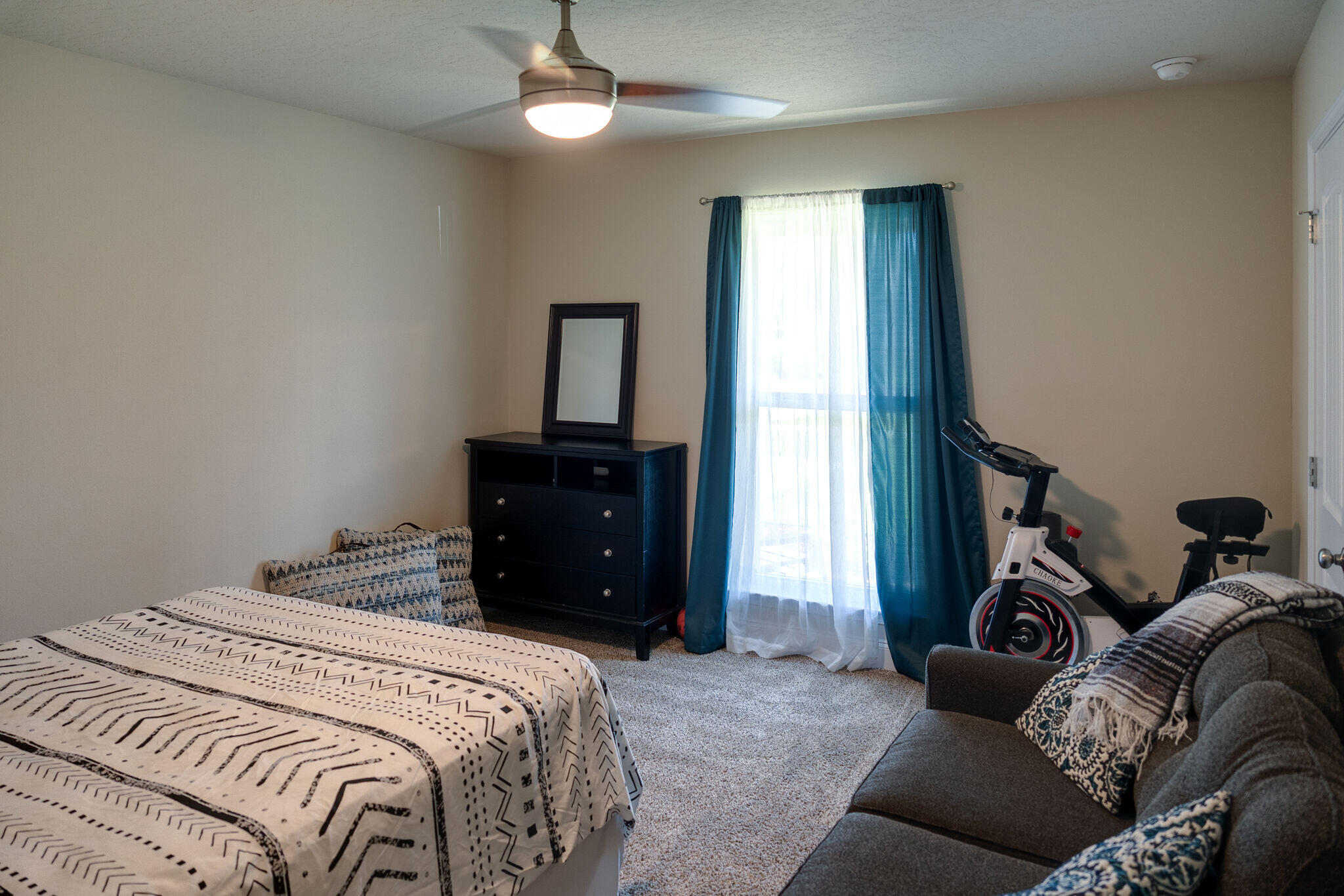 4723 Chanson Crossing Crestview, FL 32539 - Photo 35 of 58 a bedroom with a bed and a chandelier