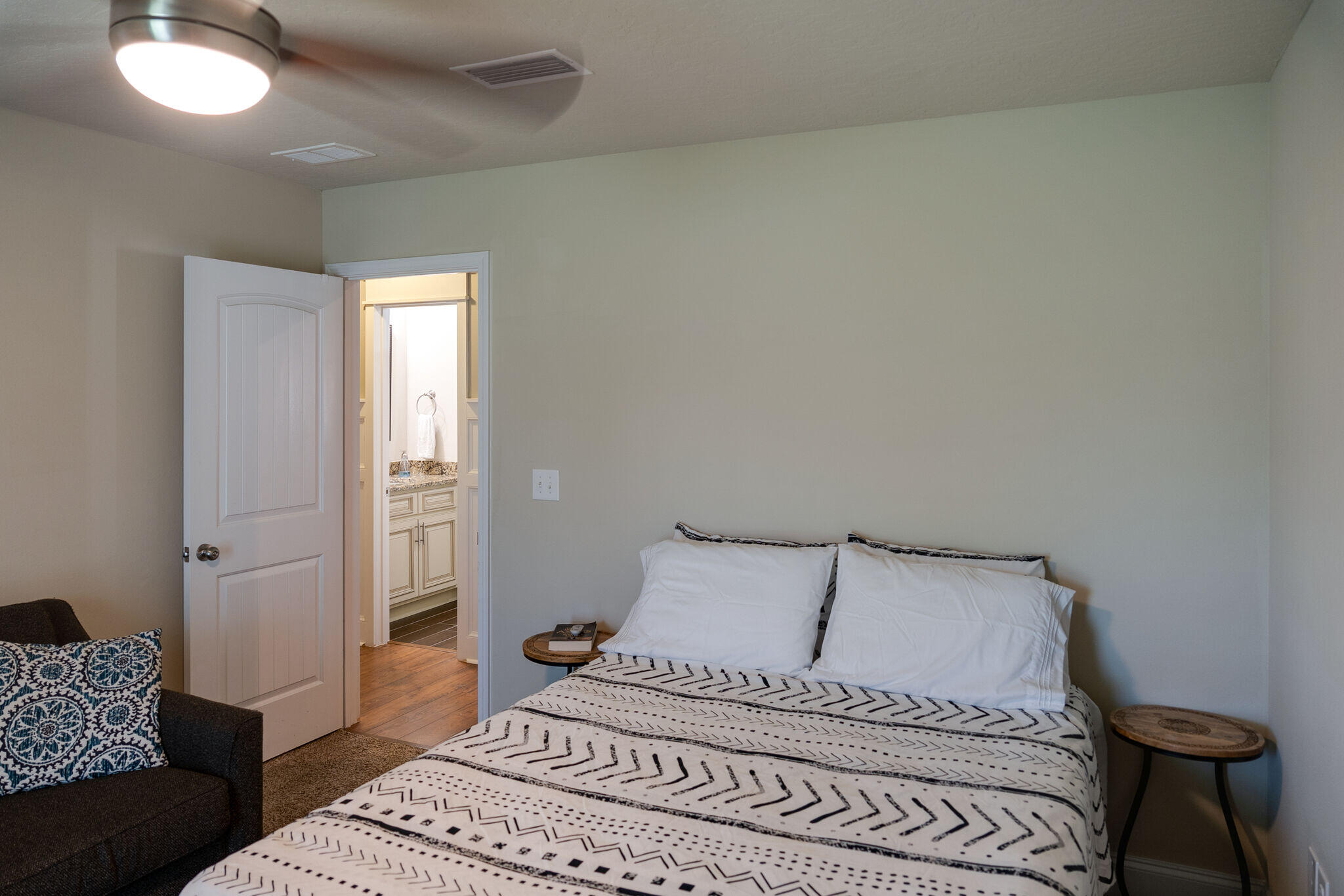 4723 Chanson Crossing Crestview, FL 32539 - Photo 36 of 58 a bedroom with a bed and a couch