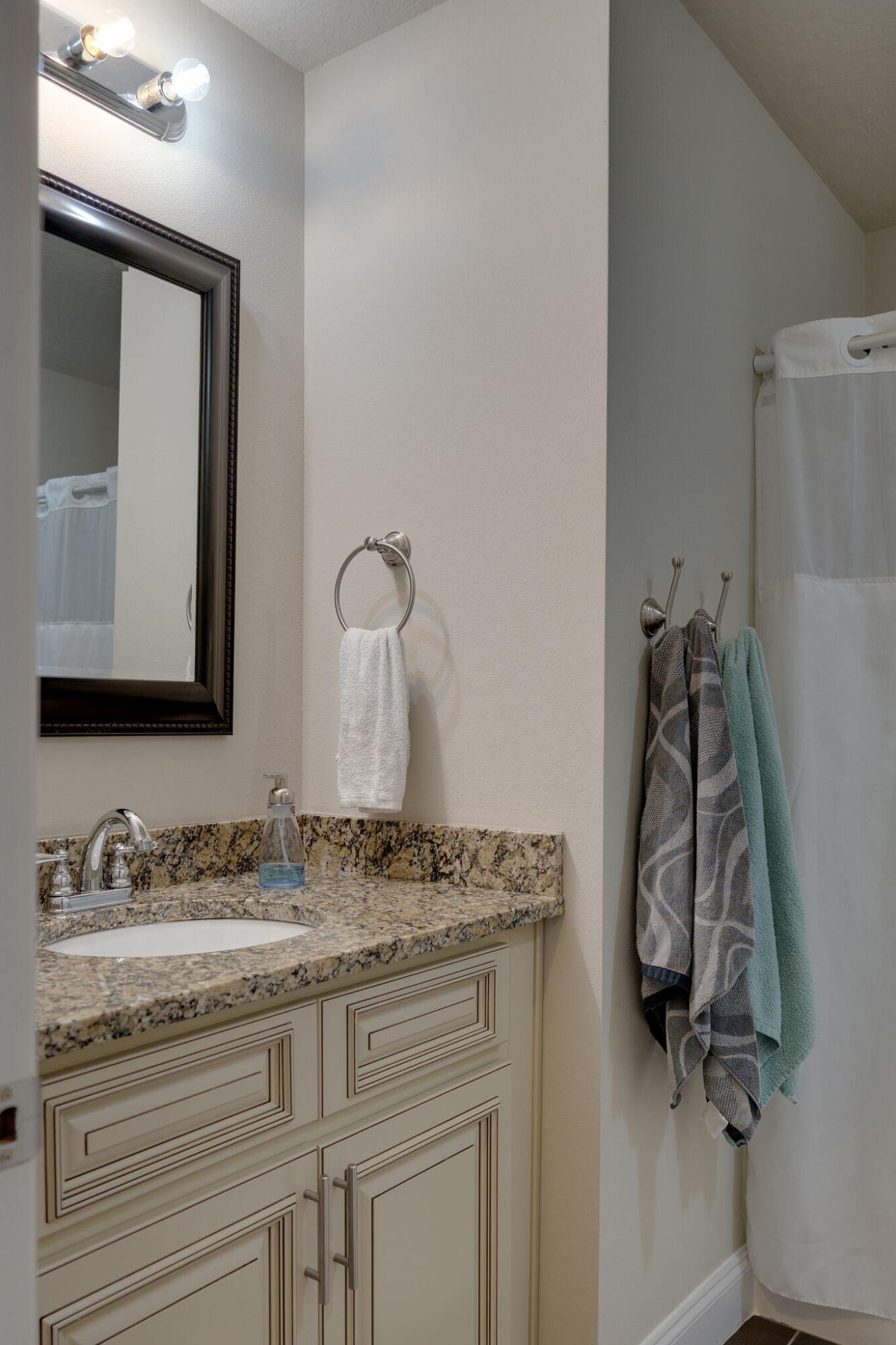 4723 Chanson Crossing Crestview, FL 32539 - Photo 37 of 58 a bathroom with a granite countertop sink and a mirror