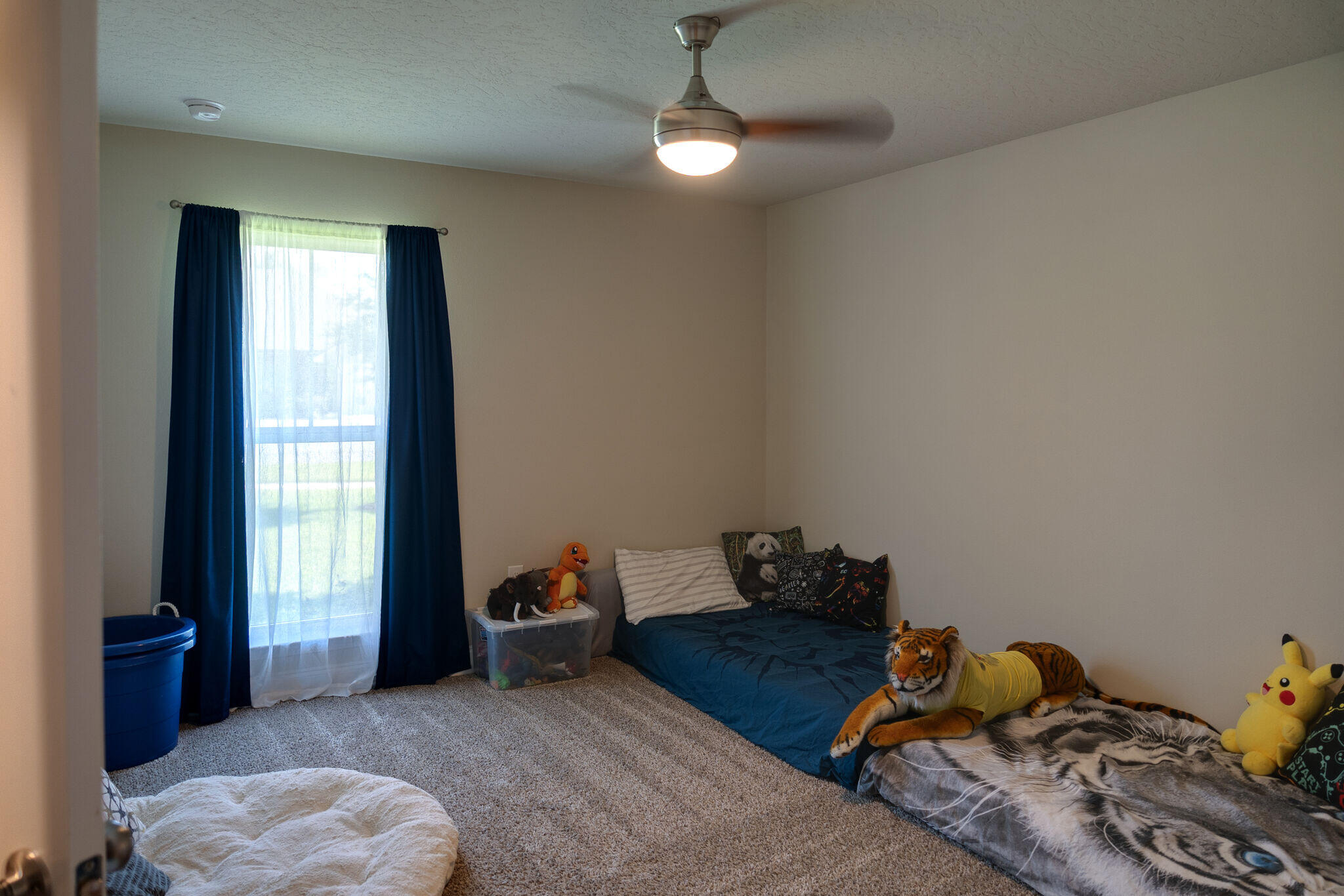 4723 Chanson Crossing Crestview, FL 32539 - Photo 39 of 58 a bedroom with bed and a window
