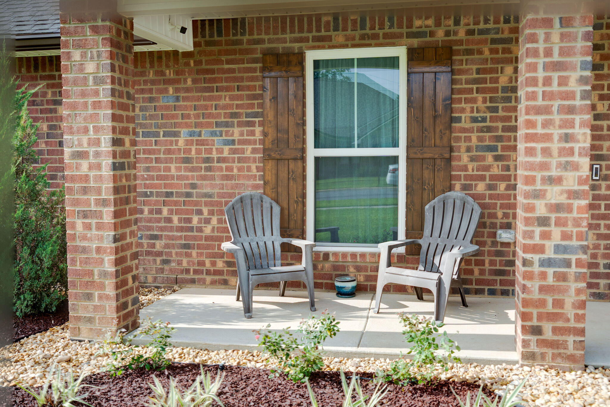 4723 Chanson Crossing Crestview, FL 32539 - Photo 4 of 58 a building outdoor space with patio furniture and potted plants