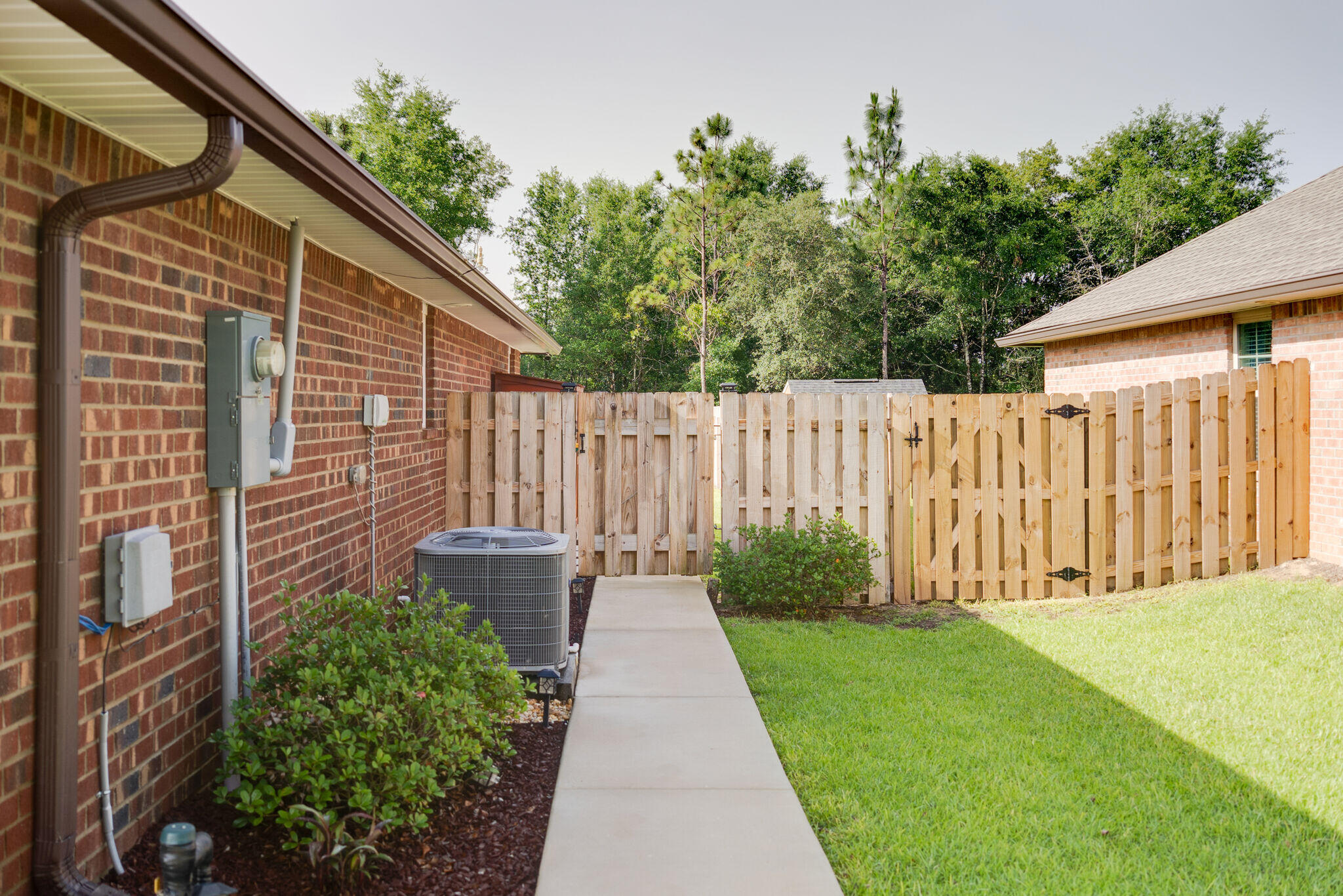 4723 Chanson Crossing Crestview, FL 32539 - Photo 42 of 58 a backyard of a house with lots of green space