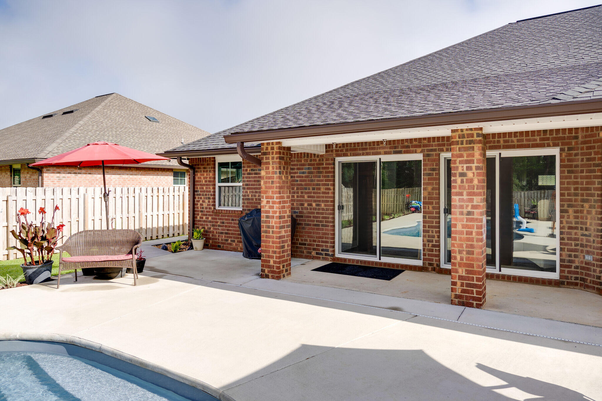 4723 Chanson Crossing Crestview, FL 32539 - Photo 46 of 58 a backyard of a house with seating space