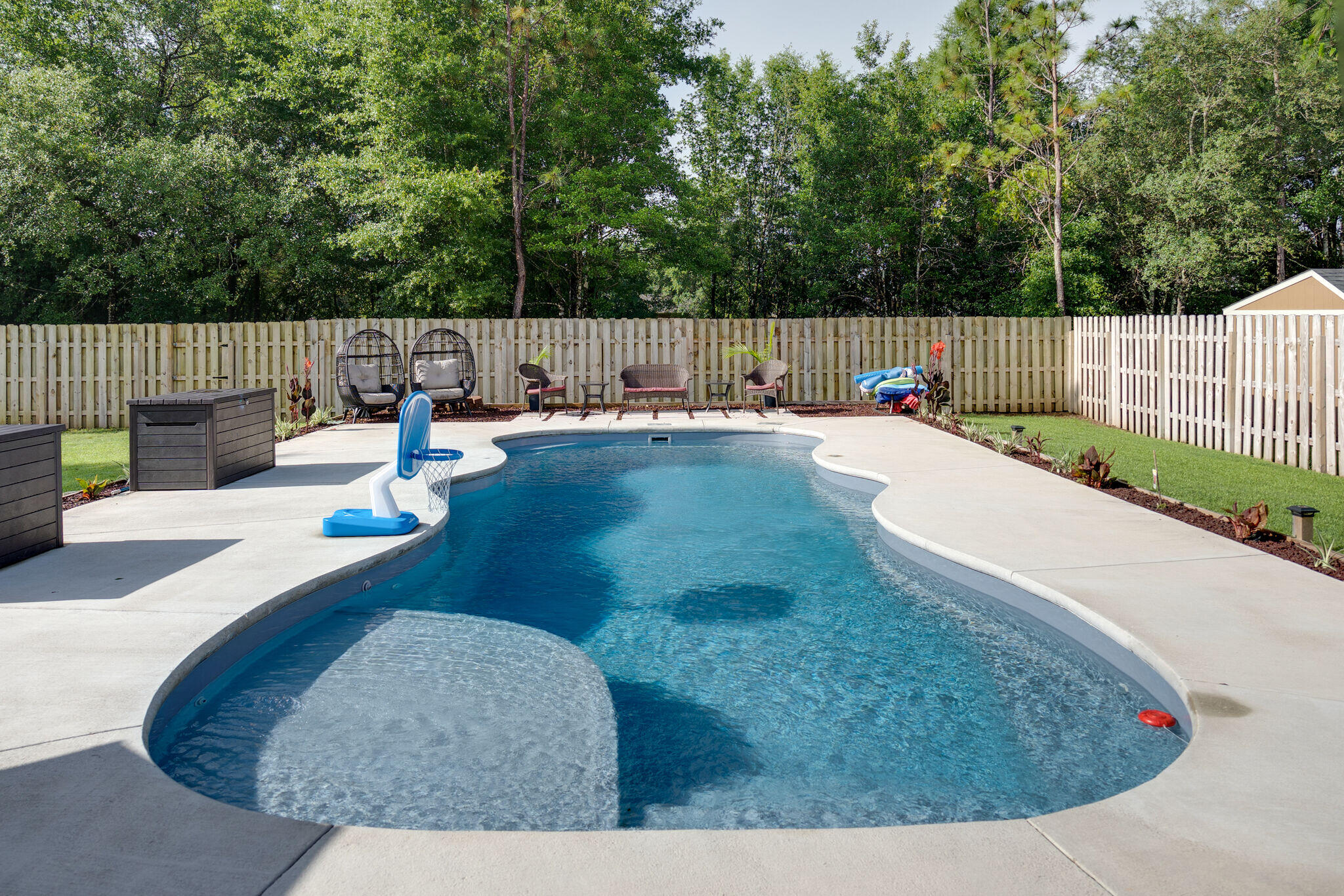 4723 Chanson Crossing Crestview, FL 32539 - Photo 48 of 58 a view of a backyard and swimming pool