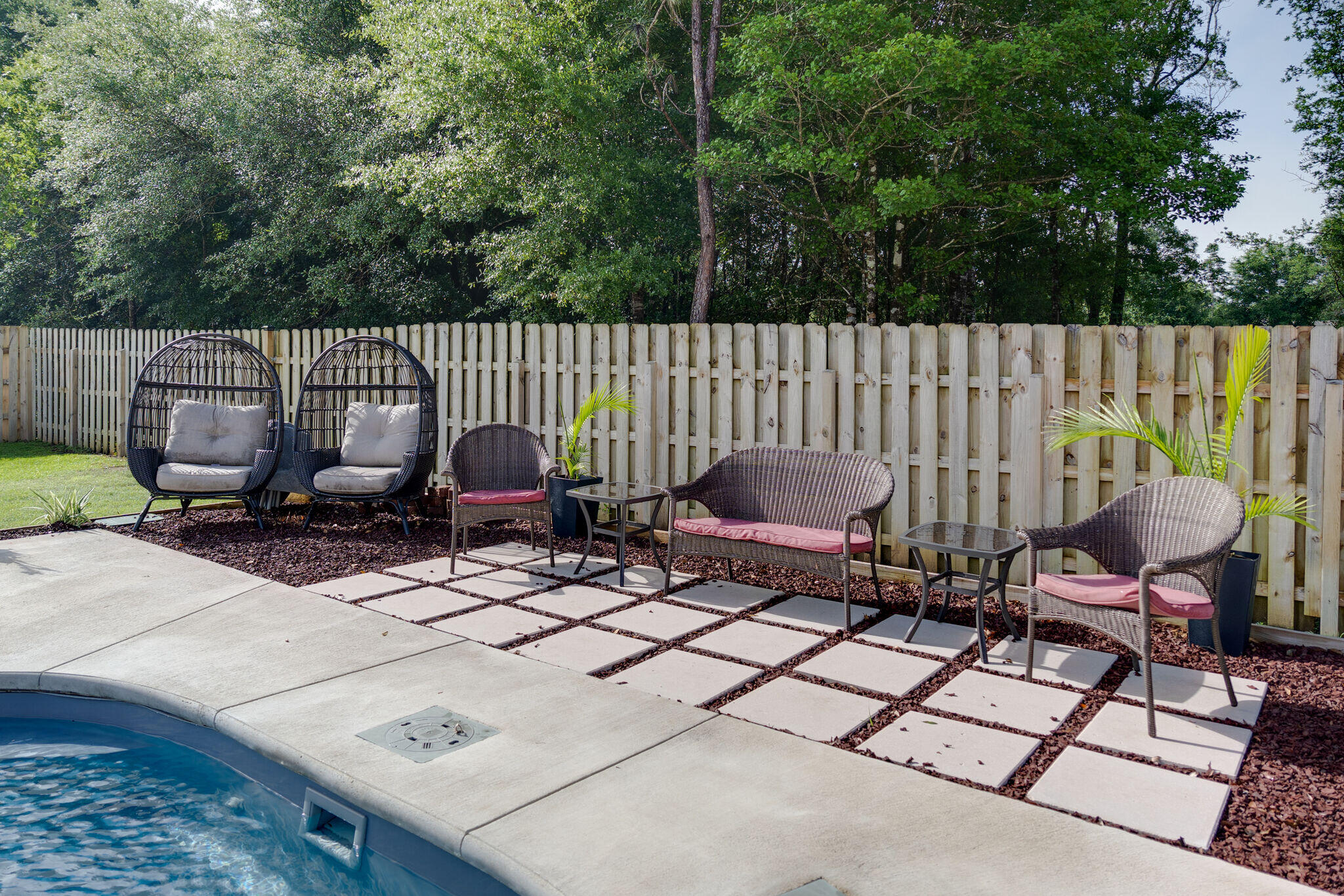 4723 Chanson Crossing Crestview, FL 32539 - Photo 51 of 58 a view of a chairs and table in backyard