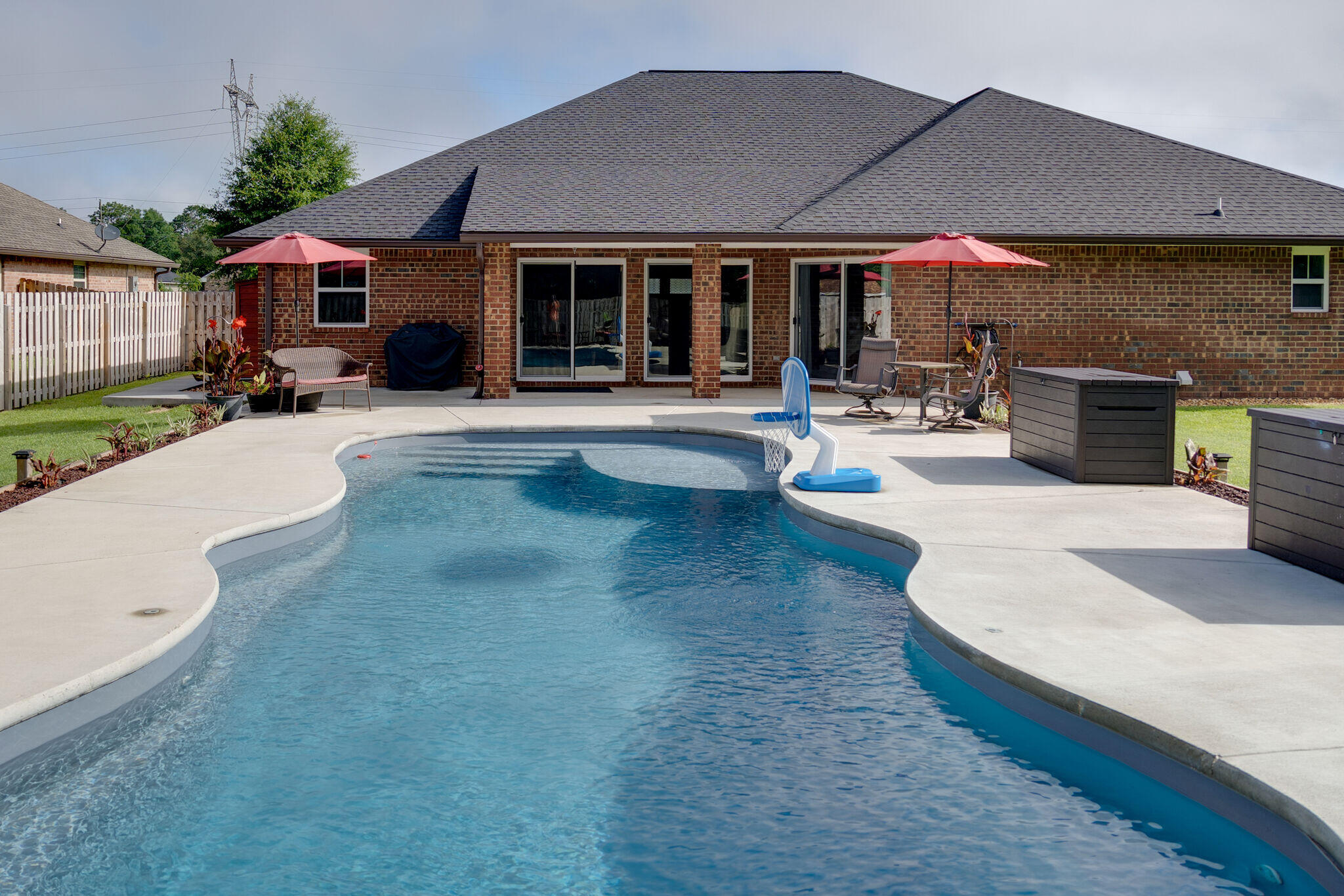 4723 Chanson Crossing Crestview, FL 32539 - Photo 53 of 58 a swimming pool with outdoor seating and yard