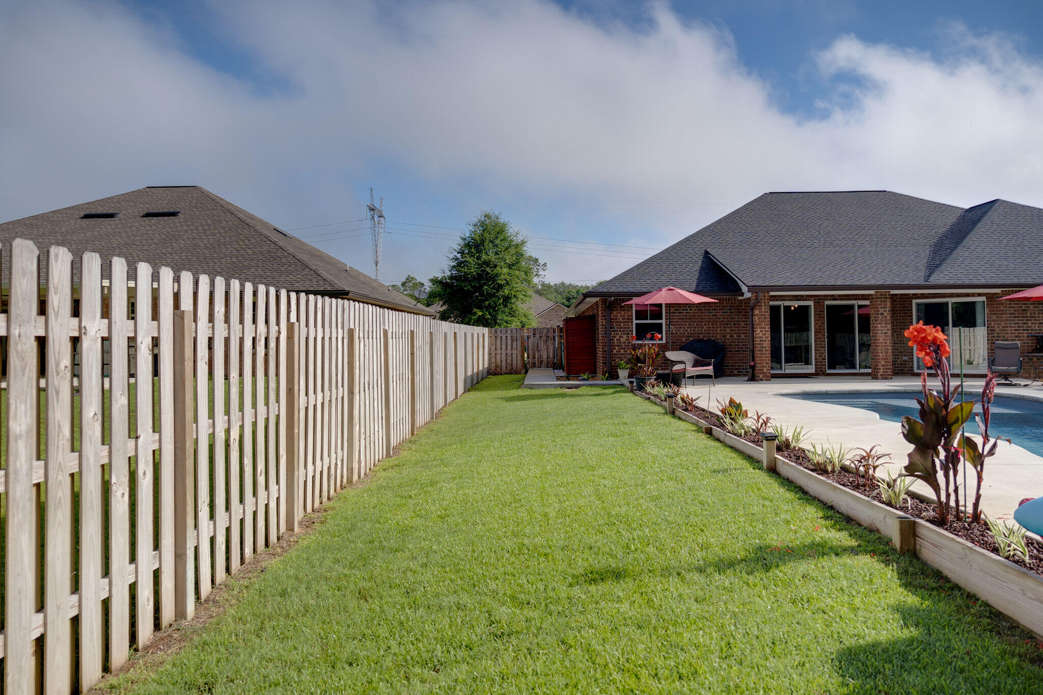 4723 Chanson Crossing Crestview, FL 32539 - Photo 55 of 58 a view of a house with backyard and porch