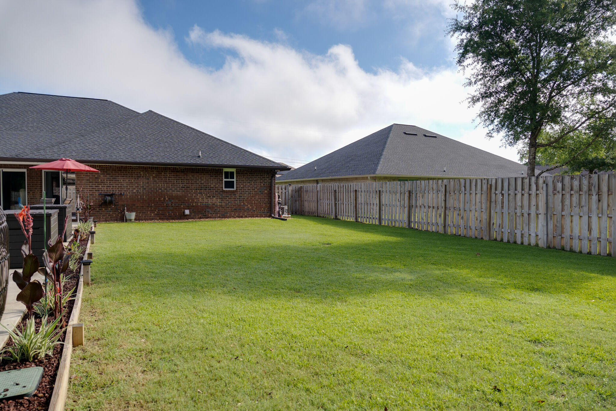 4723 Chanson Crossing Crestview, FL 32539 - Photo 57 of 58 a view of a yard in front of a house