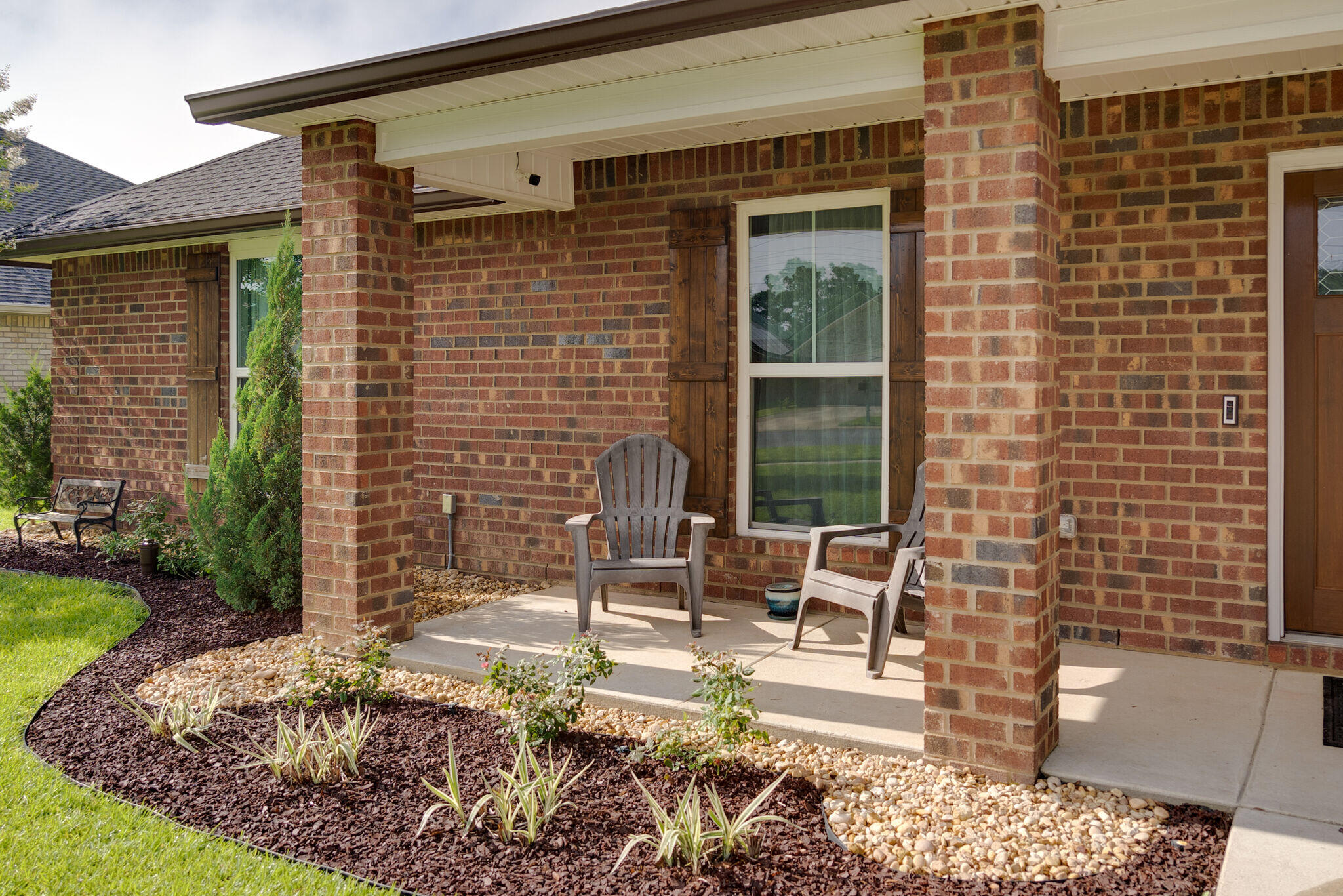 4723 Chanson Crossing Crestview, FL 32539 - Photo 6 of 58 a front view of a house with outdoor seating