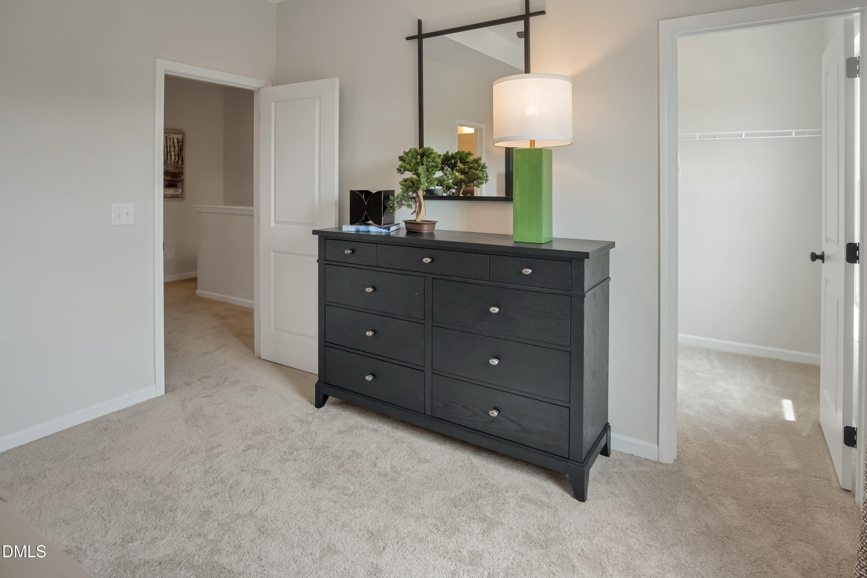 722 Orch Vista Circle Raleigh, NC 27606 - Photo 13 of 30 a room with a lamp and a mirror