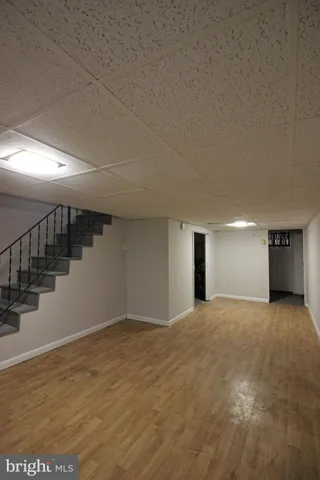 a view of empty room with stairs