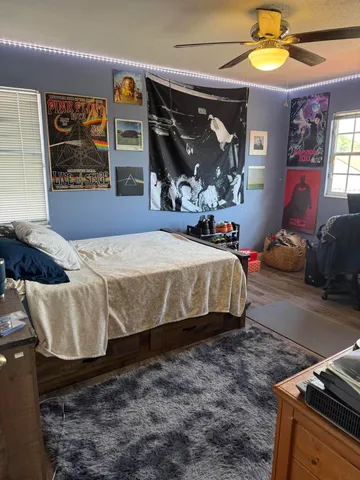 a bedroom with a bed and a mirror