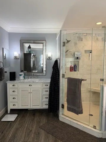 a spacious bathroom with a double vanity sink and a mirror