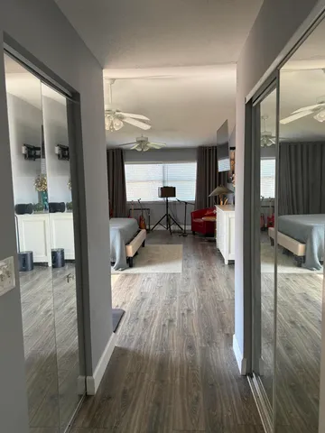 a view of living room with furniture and wooden floor