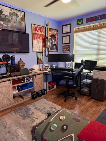 a workspace with furniture and window