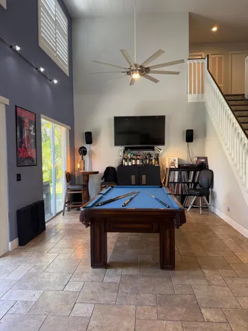 a room with furniture and pool table