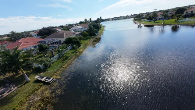 an aerial view of a house with a yard