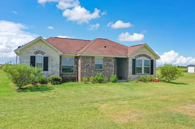a view of a river and garden in the background
