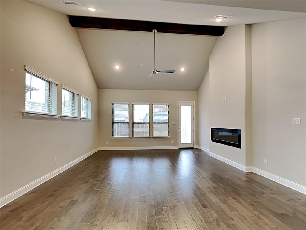 8262 Ottowa Ridge Frisco, TX 75034 - Photo 2 of 24 an empty room with wooden floor and windows