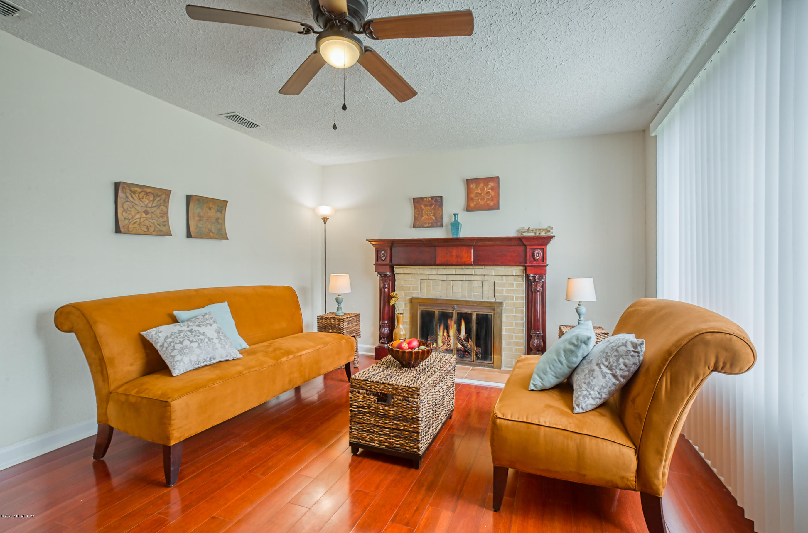 4615 Birkenhead Road Jacksonville, FL 32210 - Photo 1 of 45 a living room with furniture and a fireplace