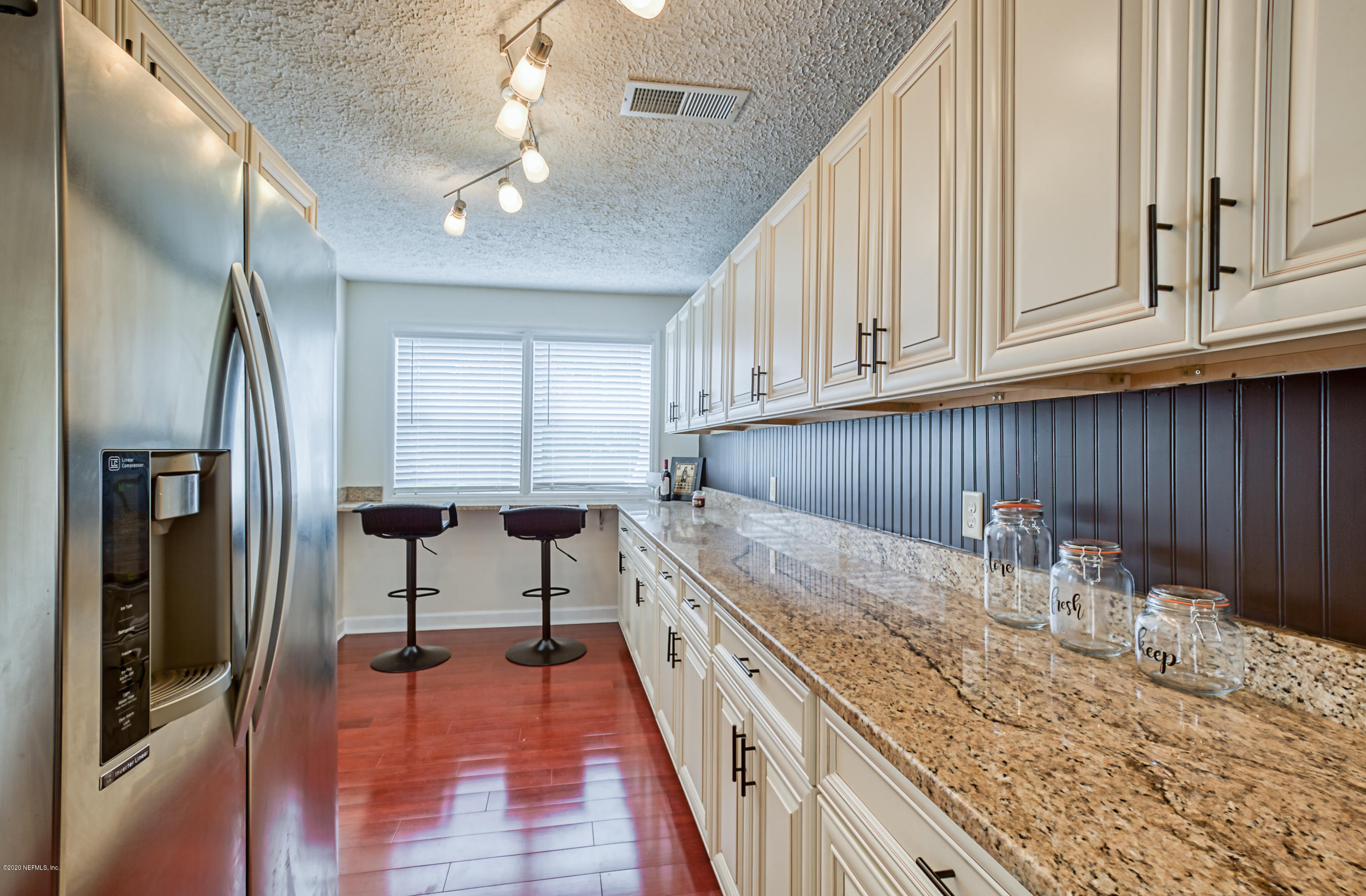 4615 Birkenhead Road Jacksonville, FL 32210 - Photo 16 of 45 a kitchen with granite countertop cabinets a sink and dishwasher