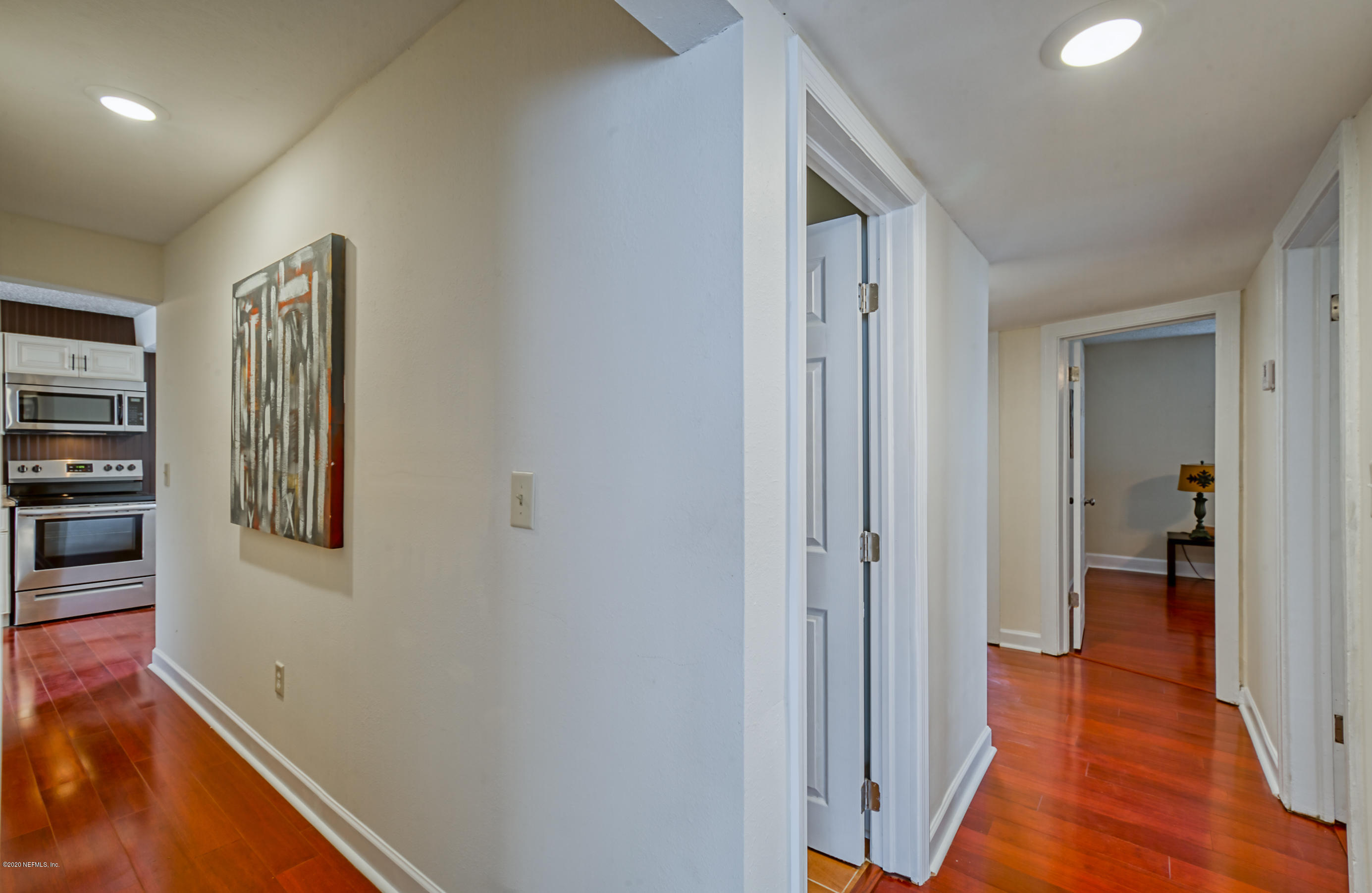 4615 Birkenhead Road Jacksonville, FL 32210 - Photo 20 of 45 a view of a hallway with a livingroom and a bathroom with sink