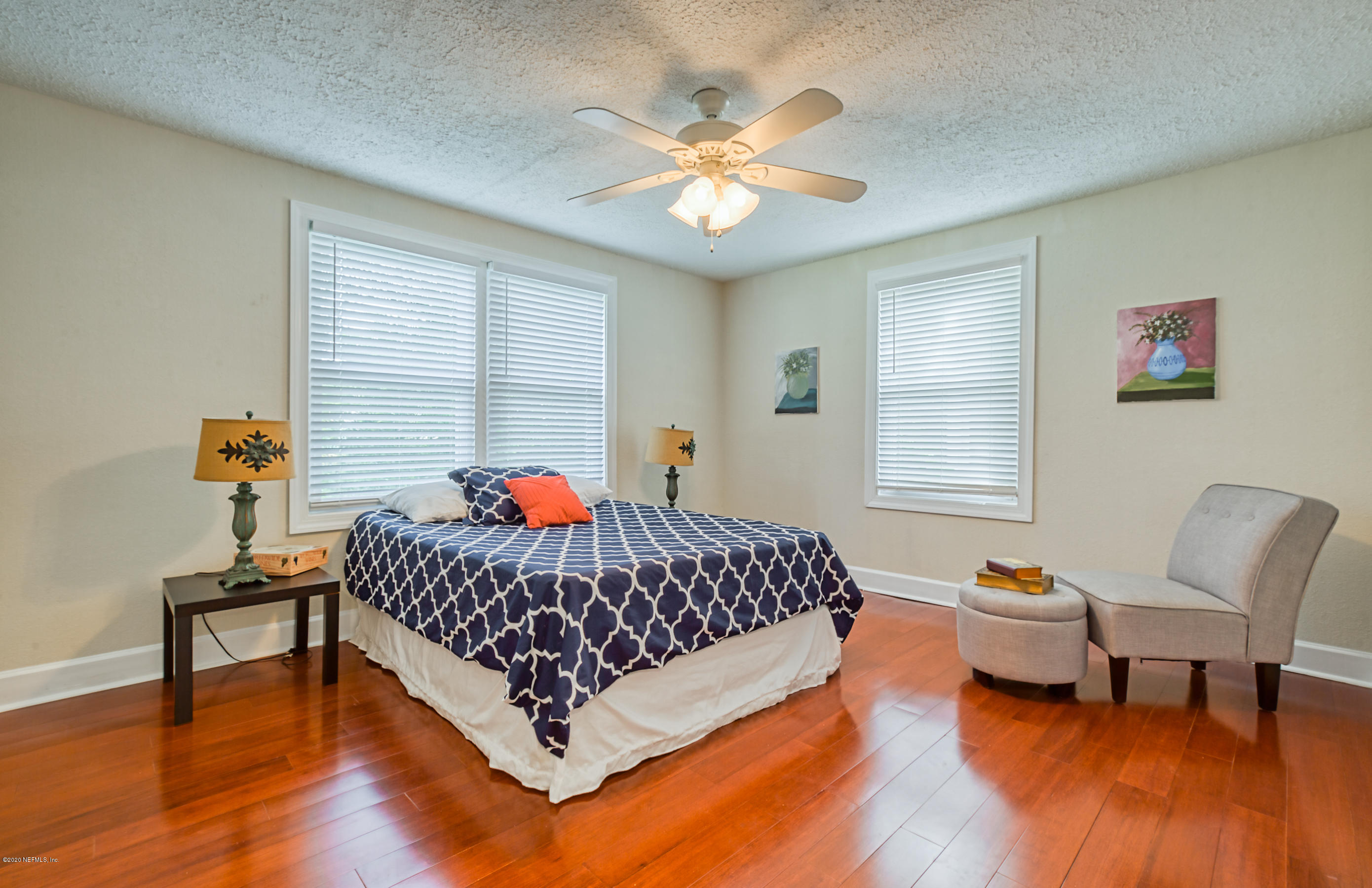4615 Birkenhead Road Jacksonville, FL 32210 - Photo 23 of 45 a bed room with a bed and a chair