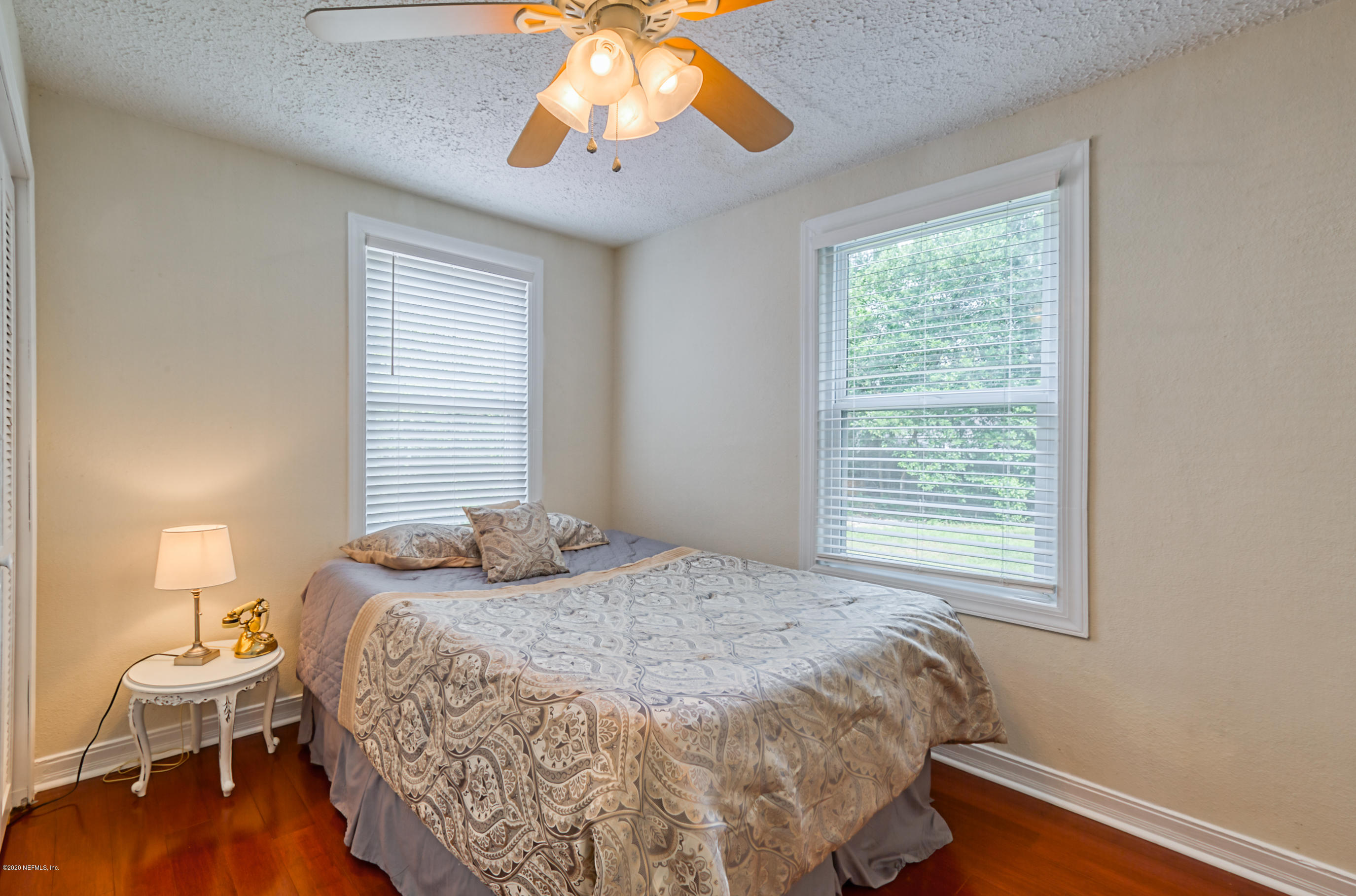 4615 Birkenhead Road Jacksonville, FL 32210 - Photo 27 of 45 a bedroom with a bed and a window