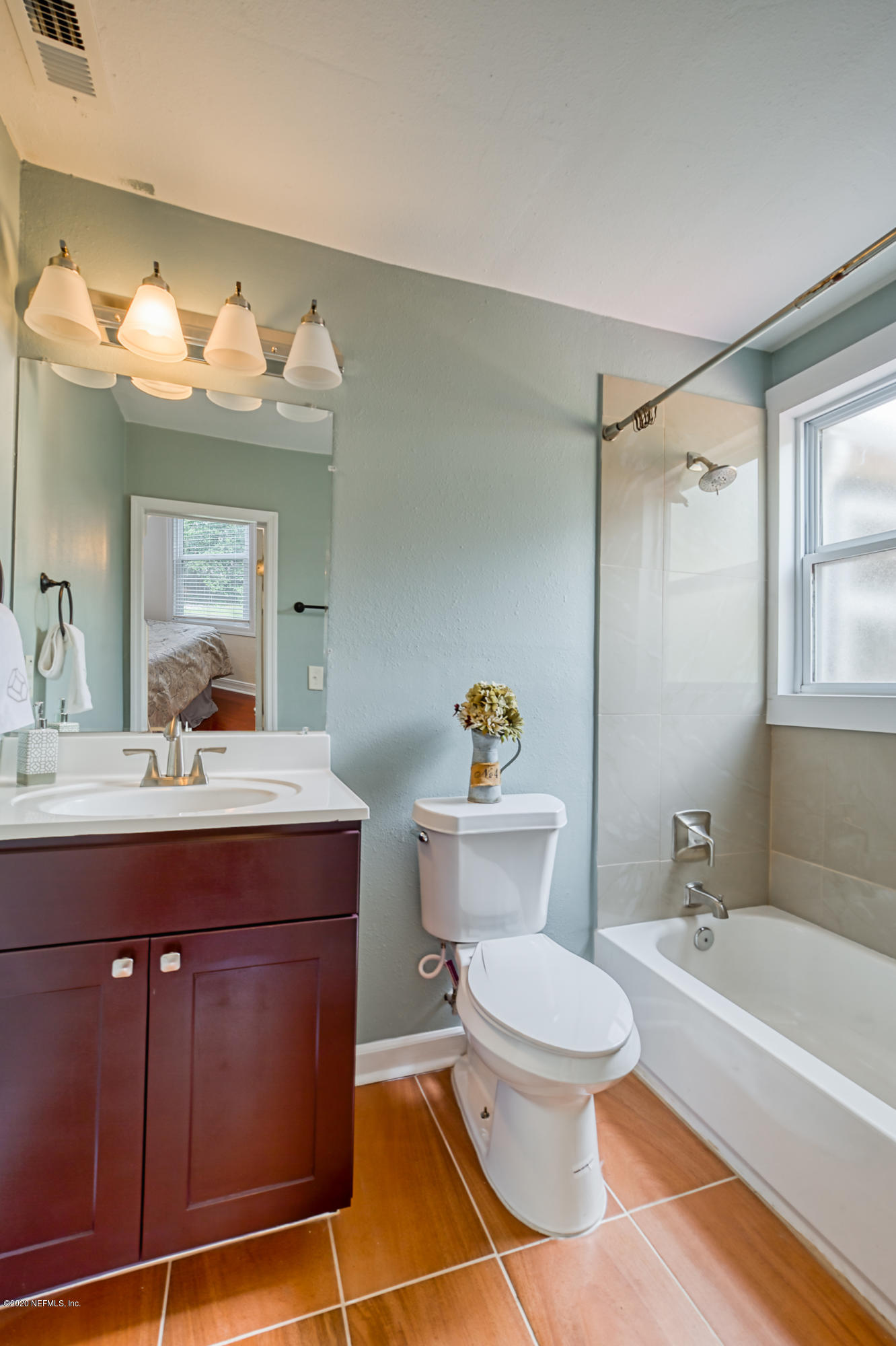 4615 Birkenhead Road Jacksonville, FL 32210 - Photo 30 of 45 a bathroom with a sink a toilet and a bathtub