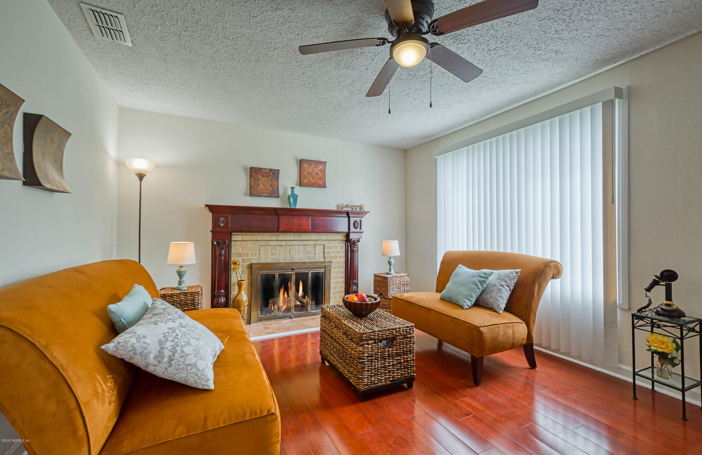 4615 Birkenhead Road Jacksonville, FL 32210 - Photo 4 of 45 a living room with furniture and a fireplace