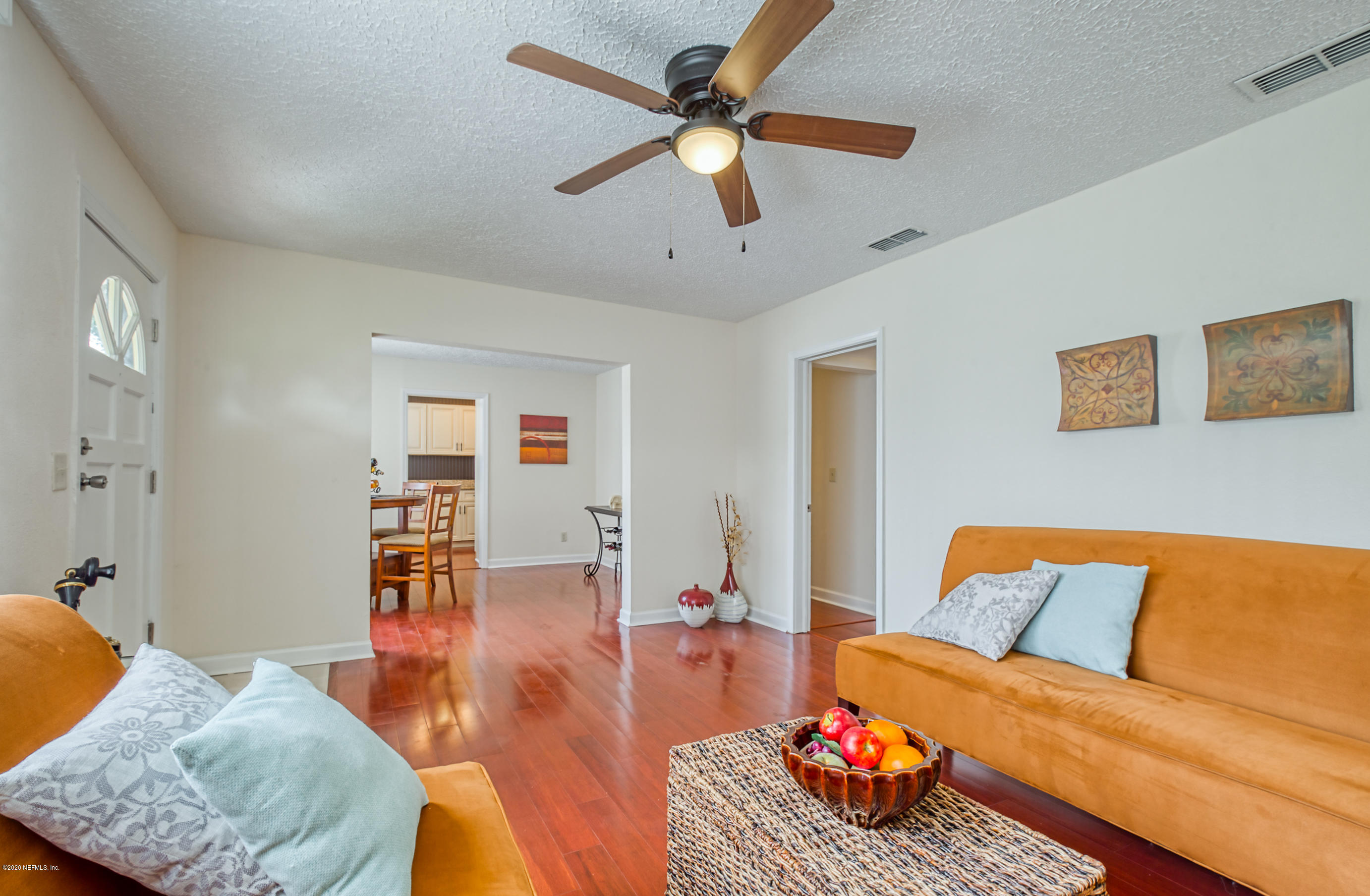 4615 Birkenhead Road Jacksonville, FL 32210 - Photo 5 of 45 a living room with furniture and wooden floor