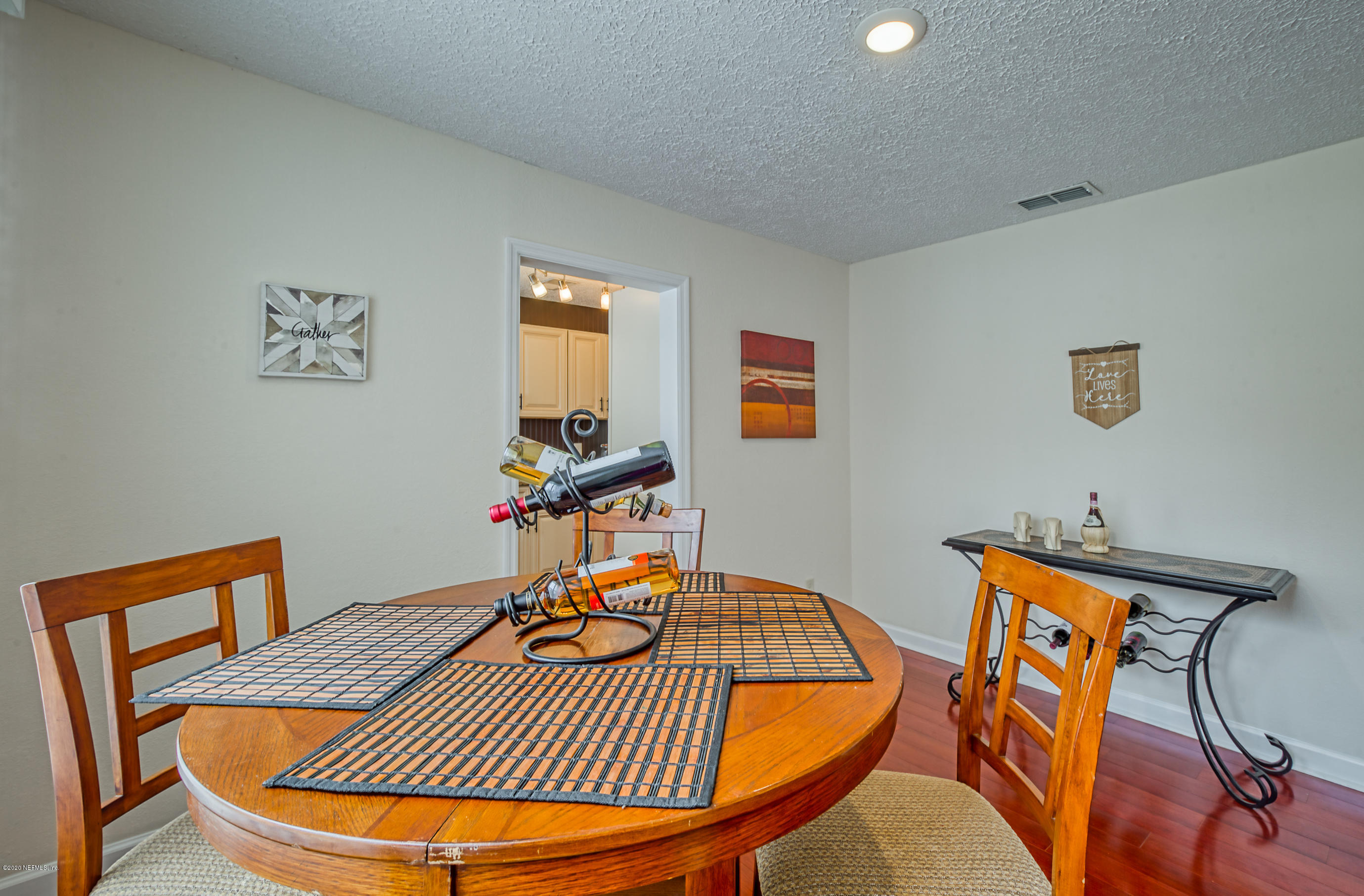 4615 Birkenhead Road Jacksonville, FL 32210 - Photo 8 of 45 a workspace with furniture and wooden floor