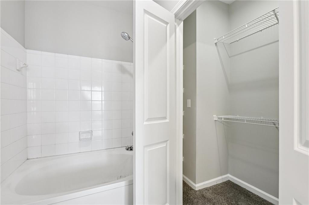 821 Ralph McGill Boulevard Northeast, Unit 3404 Atlanta, GA 30306 - Photo 13 of 18 a bathroom with a bathtub