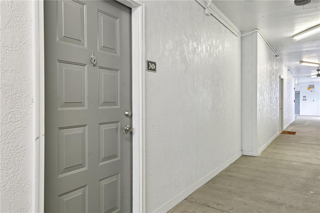 821 Ralph McGill Boulevard Northeast, Unit 3404 Atlanta, GA 30306 - Photo 14 of 18 a view of a hallway with wooden floor