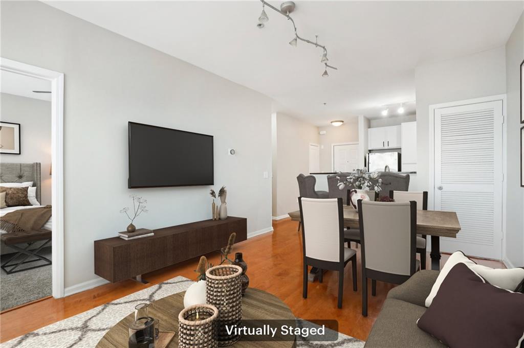 821 Ralph McGill Boulevard Northeast, Unit 3404 Atlanta, GA 30306 - Photo 3 of 18 a living room with furniture and a flat screen tv