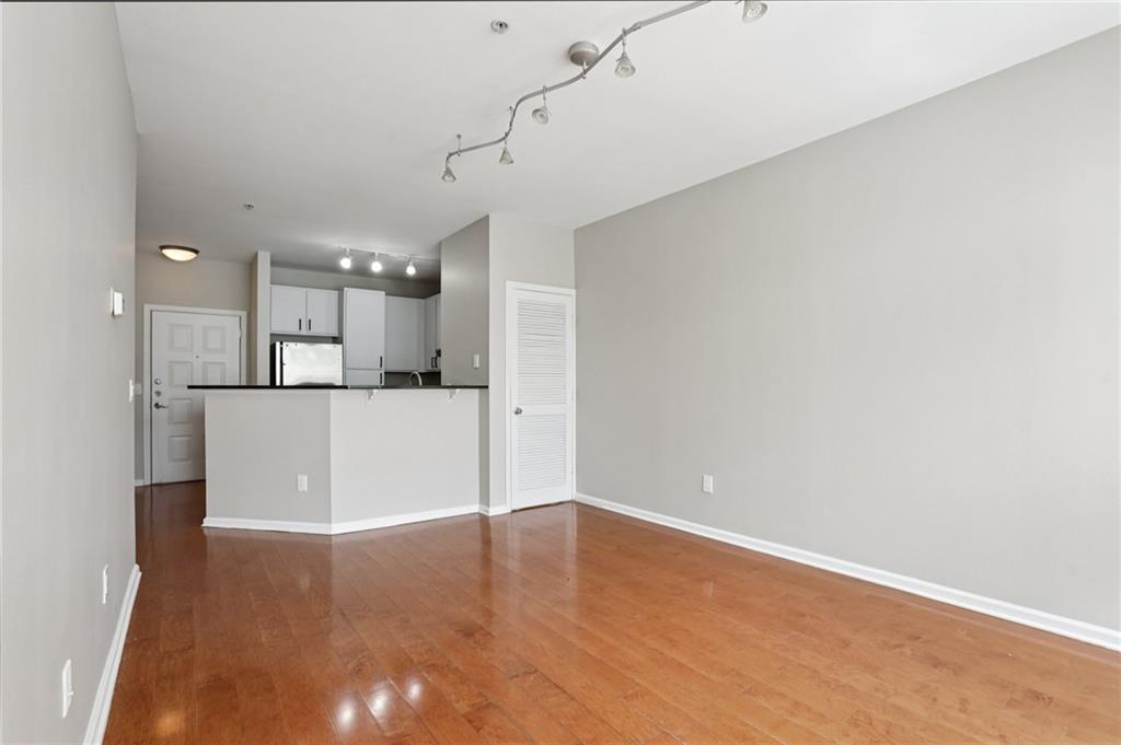 821 Ralph McGill Boulevard Northeast, Unit 3404 Atlanta, GA 30306 - Photo 5 of 18 a view of a kitchen with a refrigerator and a sink