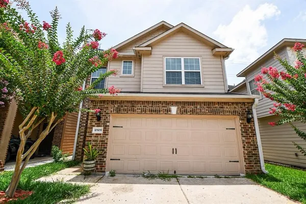 a view of a house with a garage