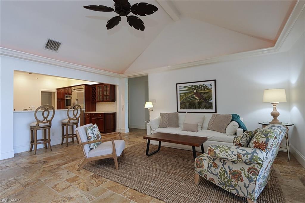 2201 Beacon Lane Naples, FL 34103 - Photo 12 of 41 a living room with furniture and a wooden floor