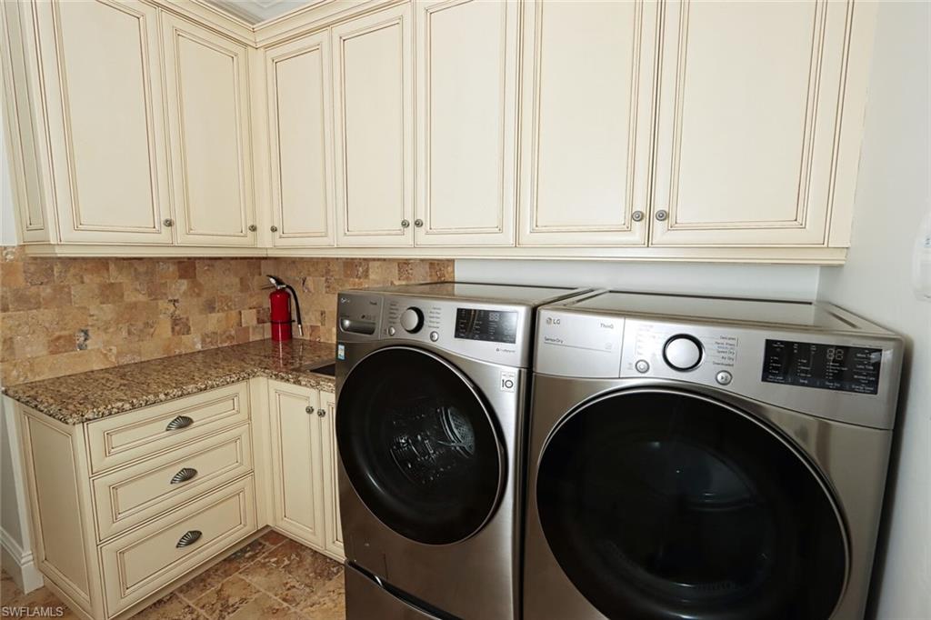 2201 Beacon Lane Naples, FL 34103 - Photo 13 of 41 a utility room with dryer and washer