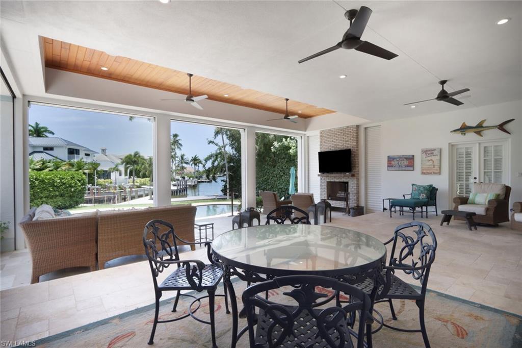 2201 Beacon Lane Naples, FL 34103 - Photo 34 of 41 a view of a dining room with furniture window and outside view
