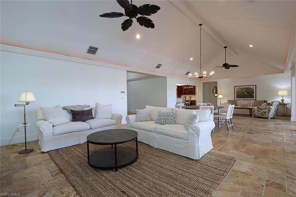 2201 Beacon Lane Naples, FL 34103 - Photo 6 of 41 a living room with furniture and a wooden floor