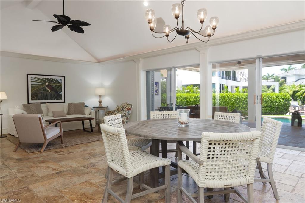 2201 Beacon Lane Naples, FL 34103 - Photo 8 of 41 a view of a dining room with furniture window and outside view
