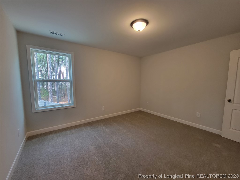 187 Timber Skip Drive Spring Lake, NC 28390 - Photo 13 of 20 an empty room with a window