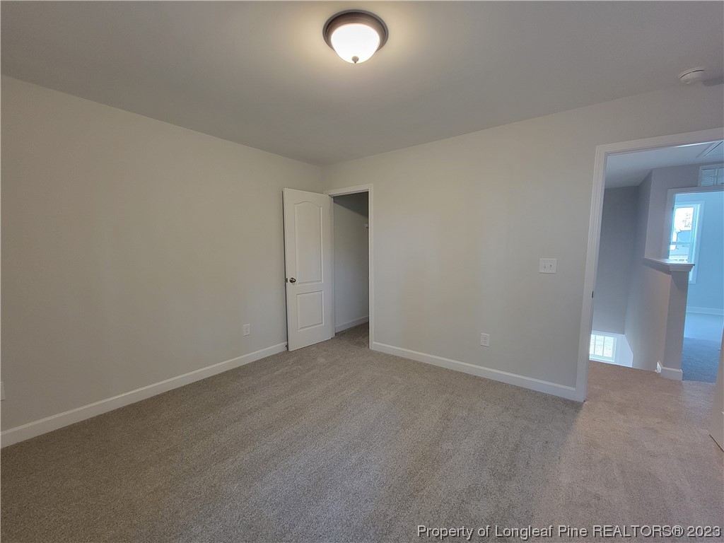 187 Timber Skip Drive Spring Lake, NC 28390 - Photo 14 of 20 an empty room with an entryway